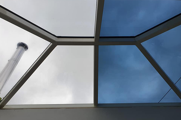 An image showing a skylight which has had Switchable Smart Film applied to half of it